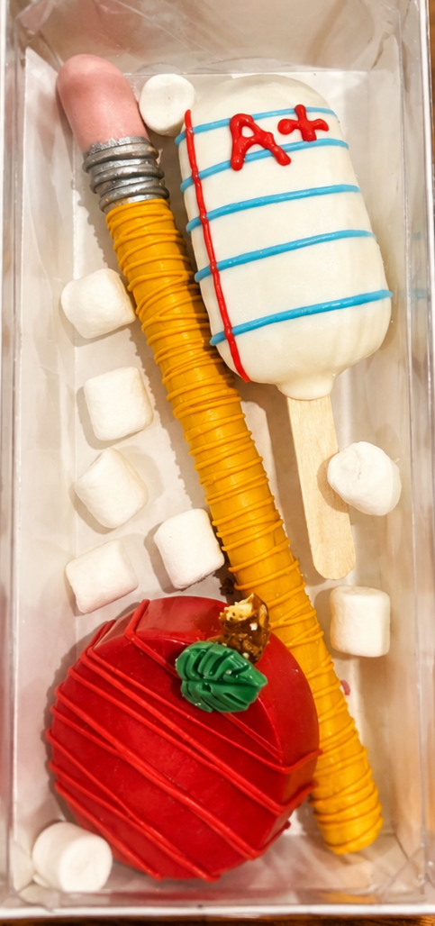 Back to school themed treats box with pencil pretzel and apple cake pop